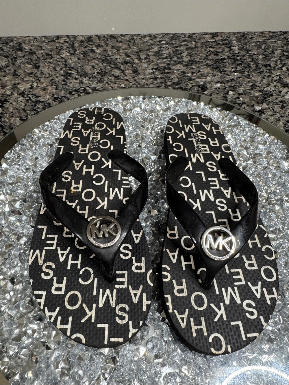 Michael Kors Black Logo Flip Flop Sandals with Silver MK Medallions EUC 7.5